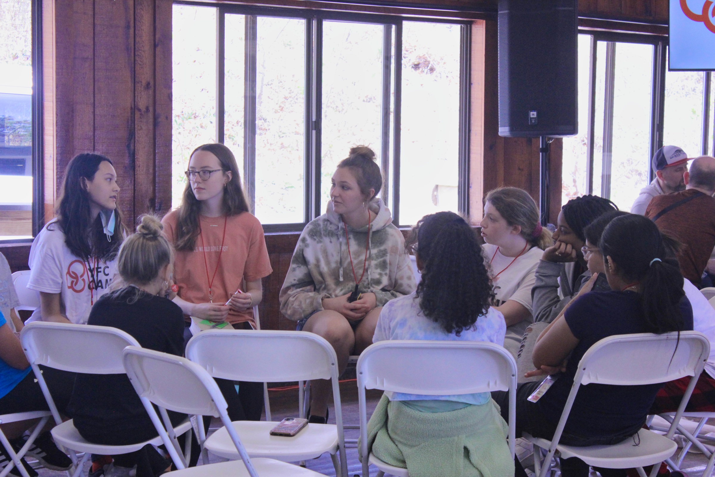 Students and a YFC Cape Cod leader sitting in a circle for conversation